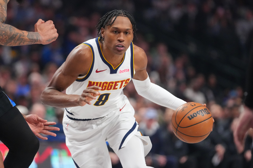 FILE - Denver Nuggets guard Peyton Watson (8) drives to the basket during the first half of an NBA basketball game between the Dallas Mavericks and the Denver Nuggets, on Jan. 14, 2026, in Dallas. (AP Photo/Julio Cortez, File)