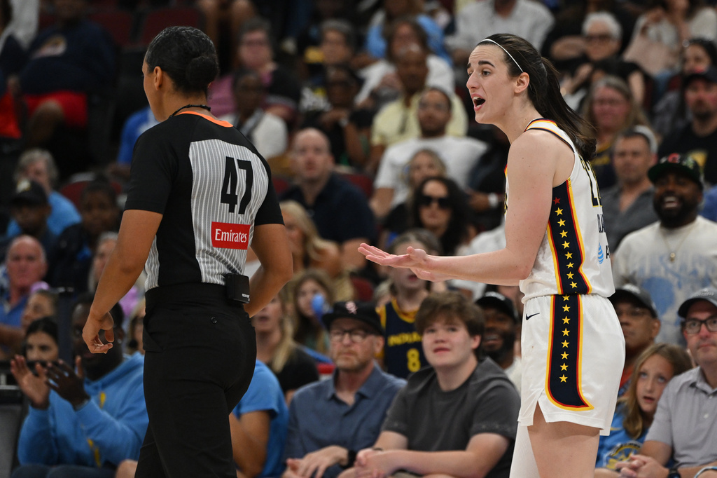 Indiana Fever's Caitlin Clark, right, argues with a referee after being called for a foul during the second half of an WNBA basketball game against the Chicago Sky in Chicago, Saturday, Aug. 8, 2026. (AP Photo/Paul Beaty)