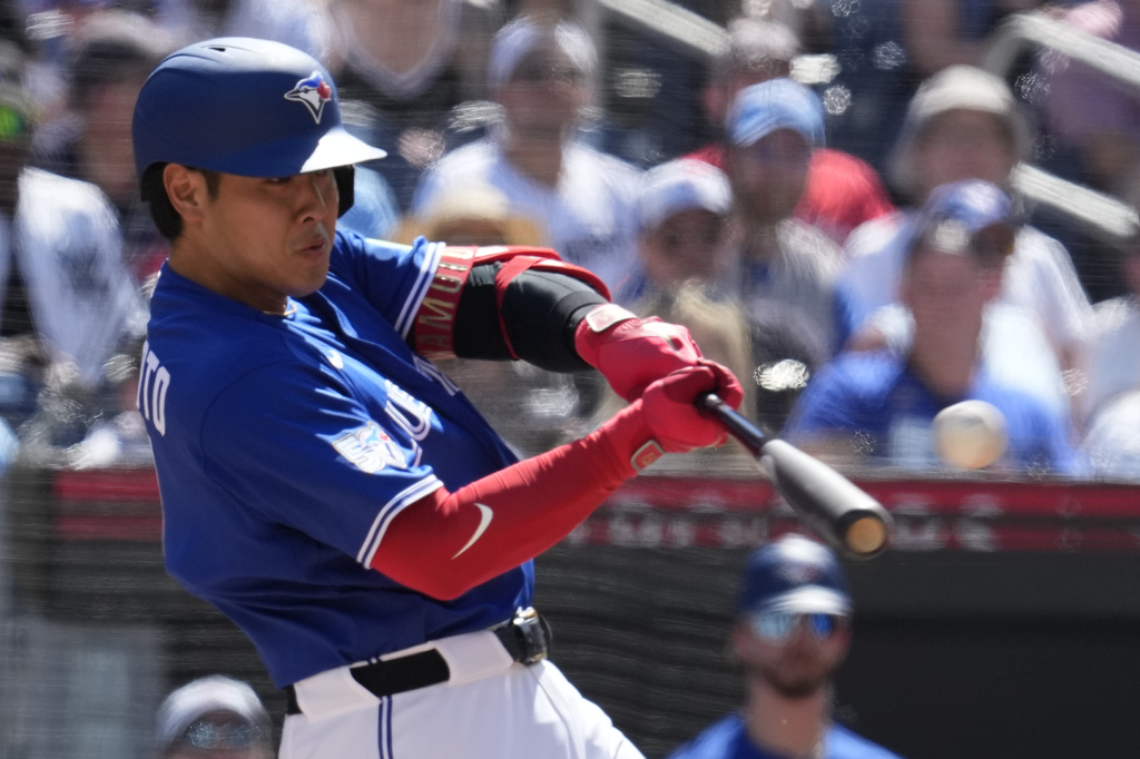 Toronto Blue Jays' Kazuma Okamoto (7) hits a solo home run against the New York Yankees during third inning of a baseball game in Toronto, Saturday, June 13, 2026. (Frank Gunn/The Canadian Press via AP)