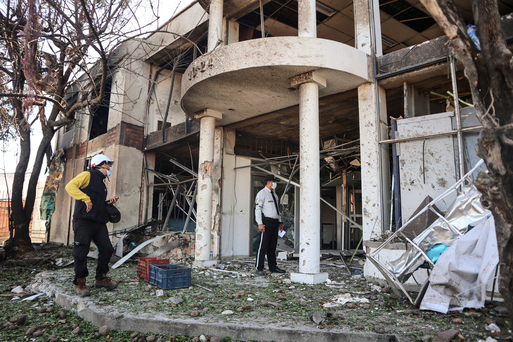 Police inspect the scene after a truck exploded outside a police station in Cucuta, Colombia, Saturday, Aug. 1, 2026. (AP Photo/Mario Caicedo)
