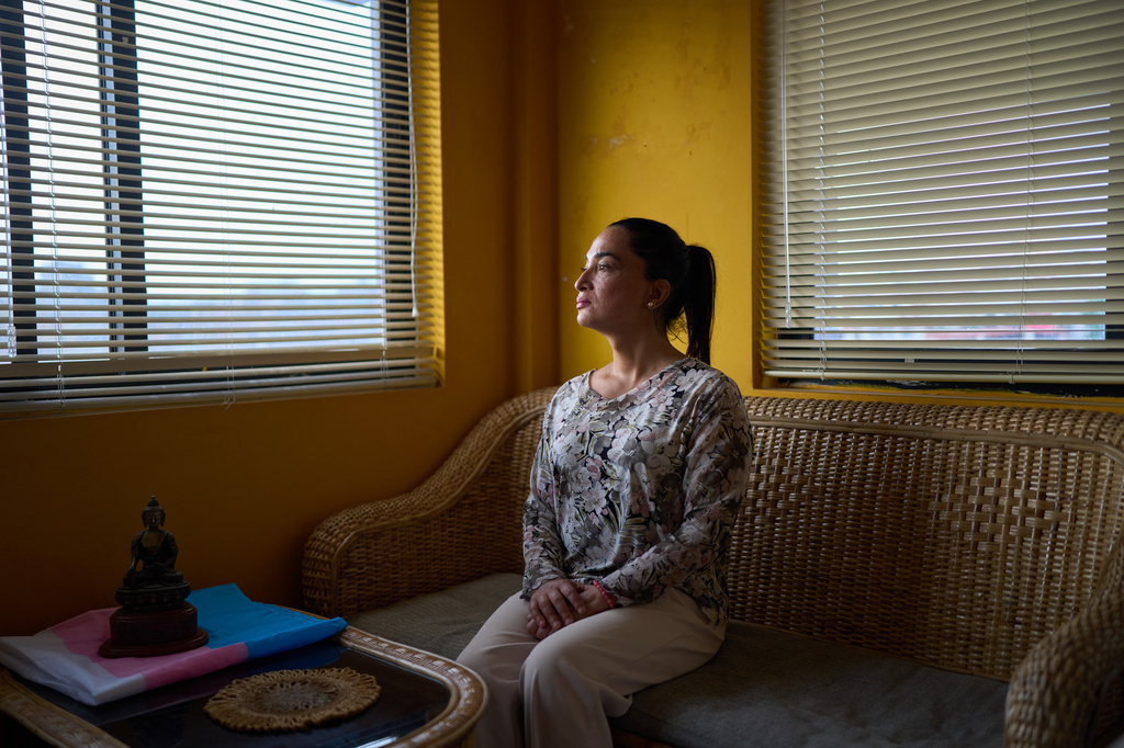 Manisha Dhakal, executive director of the Blue Diamond Society, Nepal's leading LGBTQ+ advocacy group, sits in her office, Wednesday, May 13, 2026, in Kathmandu, Nepal. (AP Photo/Bram Janssen)