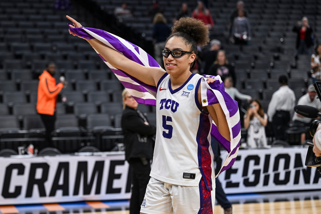 TCU guard Olivia Miles (5) smiles after her team defeated Virginia in the Sweet 16 of the NCAA college basketball tournament Saturday, March 28, 2026, in Sacramento, Calif. (AP Photo/Justine Willard)
