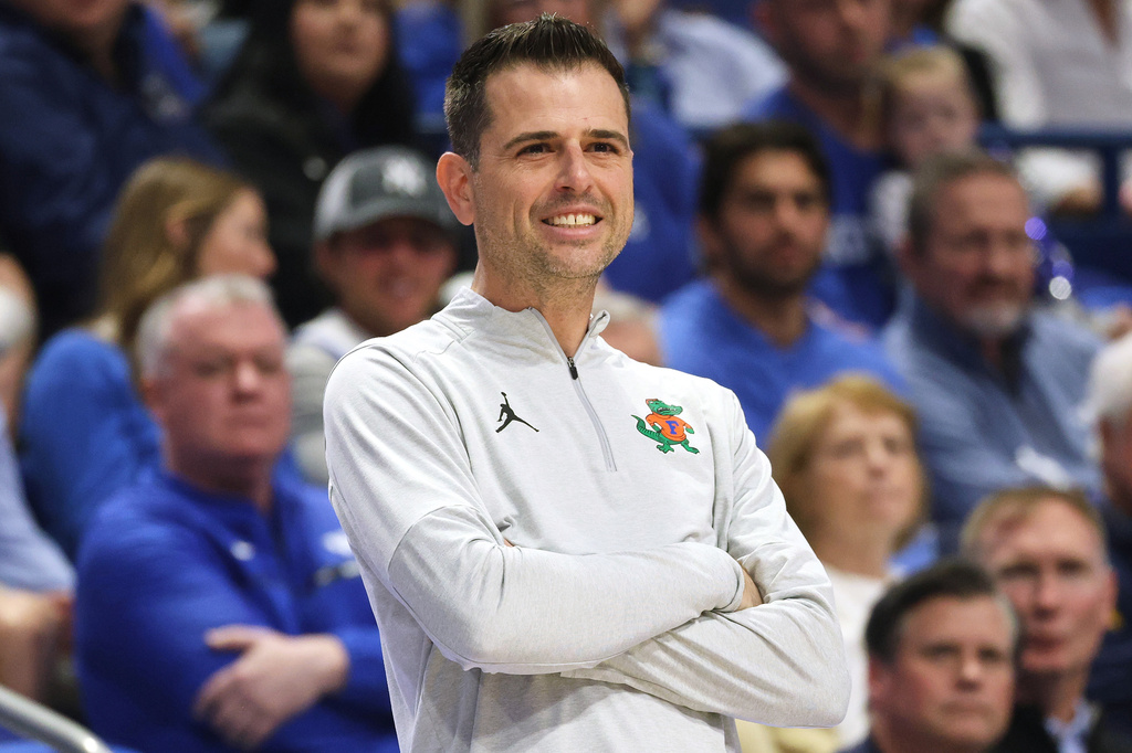 FILE - Florida head coach Todd Golden smiles during the second half of an NCAA college basketball game against Kentucky in Lexington, Ky., March 7, 2026. (AP Photo/James Crisp, File)