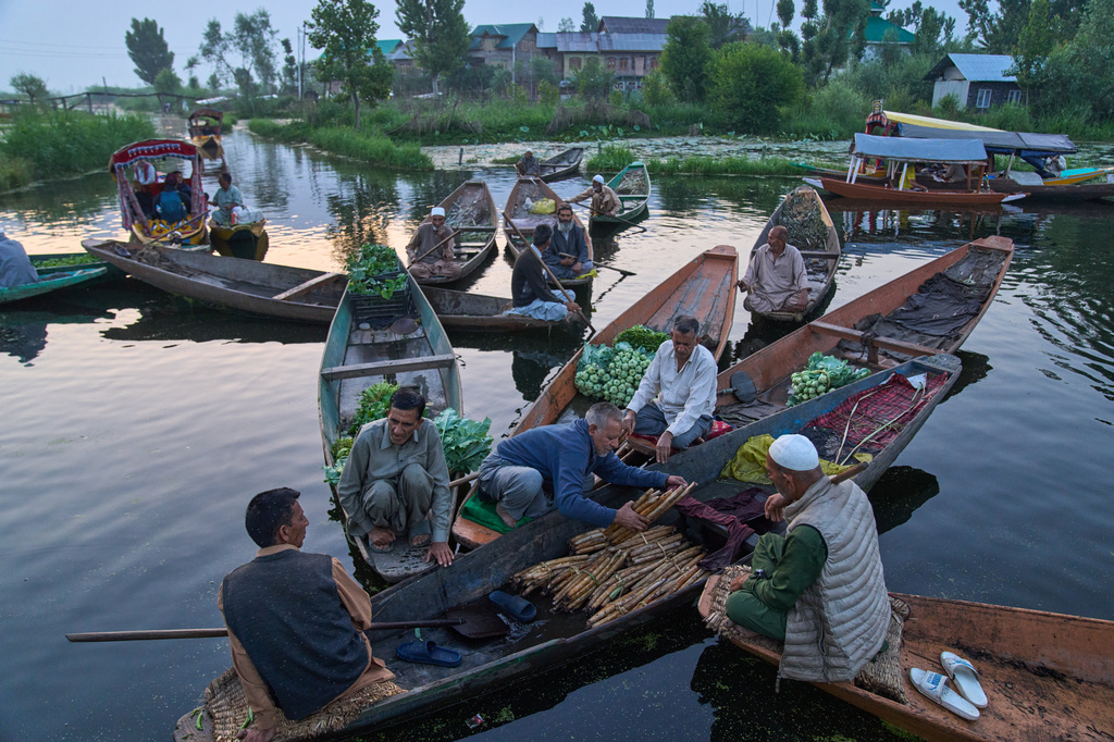 Kashmiri men sell their produce early in the morning at the floating vegetable market on Dal Lake in Srinagar, Indian Controlled Kashmir, Monday, May 18, 2026. (AP Photo/Dar Yasin)