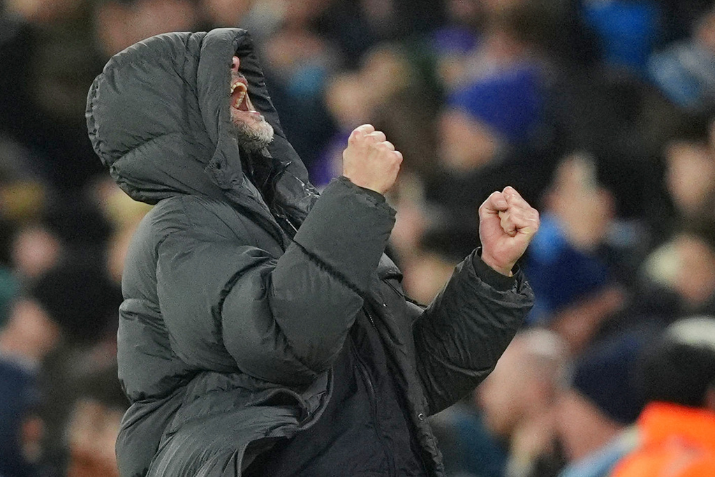 Manchester City manager Pep Guardiola celebrates their second goal during the English League Cup semifinal soccer match soccer match between Manchester City and Newcastle in Manchester, England, Wednesday, Feb. 4, 2026. (Martin Rickett/PA via AP)