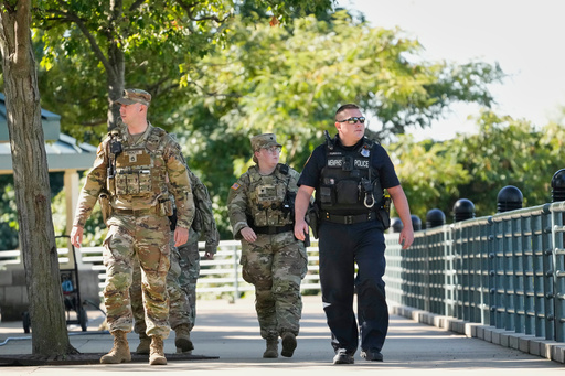 A Memphis Police Department officer, right, patrols with members of the National Guard, Friday, Oct. 10, 2025, in Memphis, Tenn. (AP Photo/George Walker IV) A Memphis Police Department officer, right, patrols with members of the National Guard, Friday, Oct. 10, 2025, in Memphis, Tenn. (AP Photo/George Walker IV)