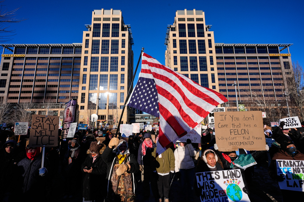 People gather during a protest Friday, Jan. 30, 2026, in Minneapolis. (AP Photo/Alex Brandon)