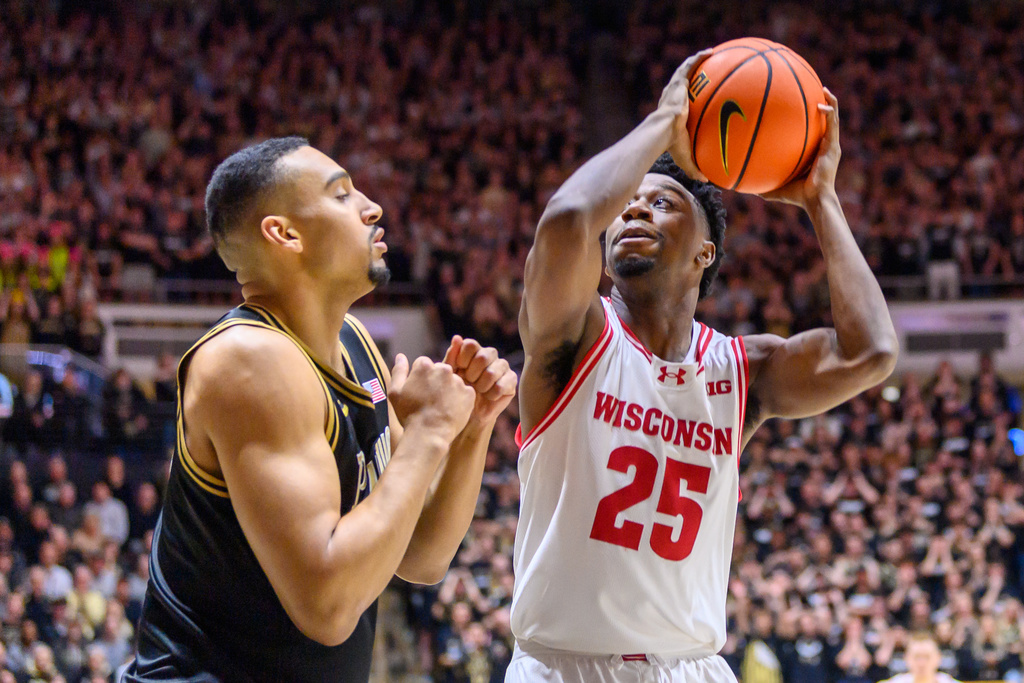 Wisconsin' John Blackwell goes up to the basket against Purdue's Trey Kaufman-Renn during the first half of an NCAA college basketball game Saturday, March 7, 2026, in West Lafayette, Ind. (AP Photo/Craig Pessman)