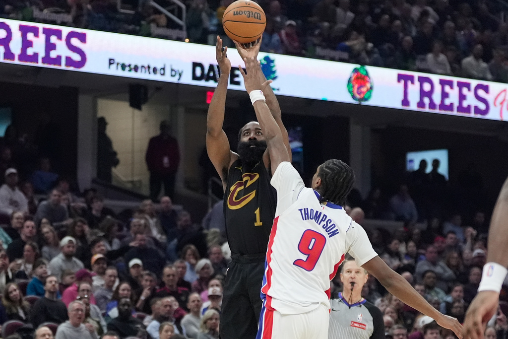Cleveland Cavaliers guard James Harden (1) shoots as Detroit Pistons guard Ausar Thompson (9) defends in the first half of an NBA basketball game in Cleveland, Tuesday, March 3, 2026. (AP Photo/Sue Ogrocki)