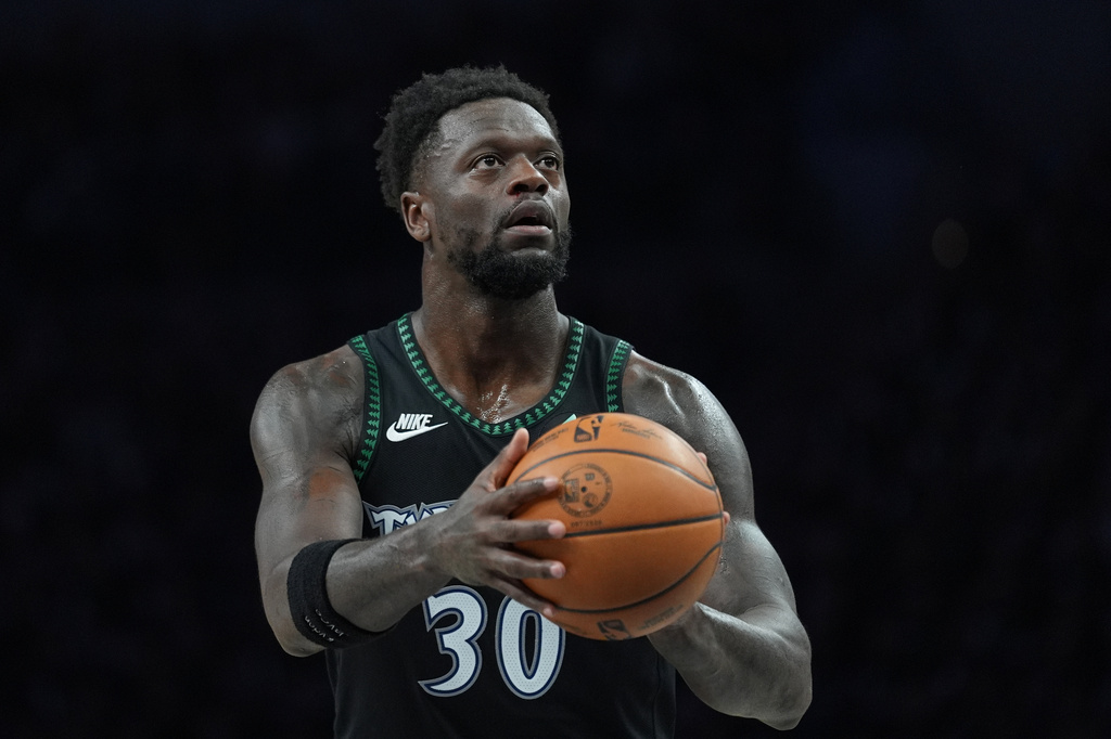 FILE - Minnesota Timberwolves forward Julius Randle shoots during the first half of Game 3 of a NBA basketball second-round playoff series against the San Antonio Spurs, May 8, 2026, in Minneapolis. (AP Photo/Abbie Parr, File)