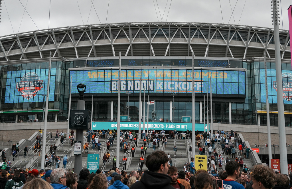 Fans arrive at Wembley Way Pre Game before an NCAA college football game between Arizona State and Kansas in London, Saturday, Sept. 19, 2026. (AP Photo/Dave Shopland)
