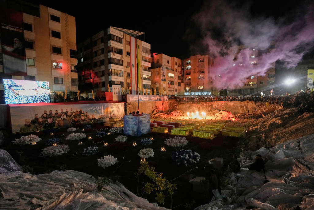 CORRECTS MONTH - People gather at the site where Hezbollah leader Hassan Nasrallah was killed in Israeli airstrikes on Sept. 27, 2024, a day before the first anniversary of his death, in the Haret Hreik suburb south of Beirut, Lebanon, Friday, Sept. 26, 2025. (AP Photo/Hassan Ammar)