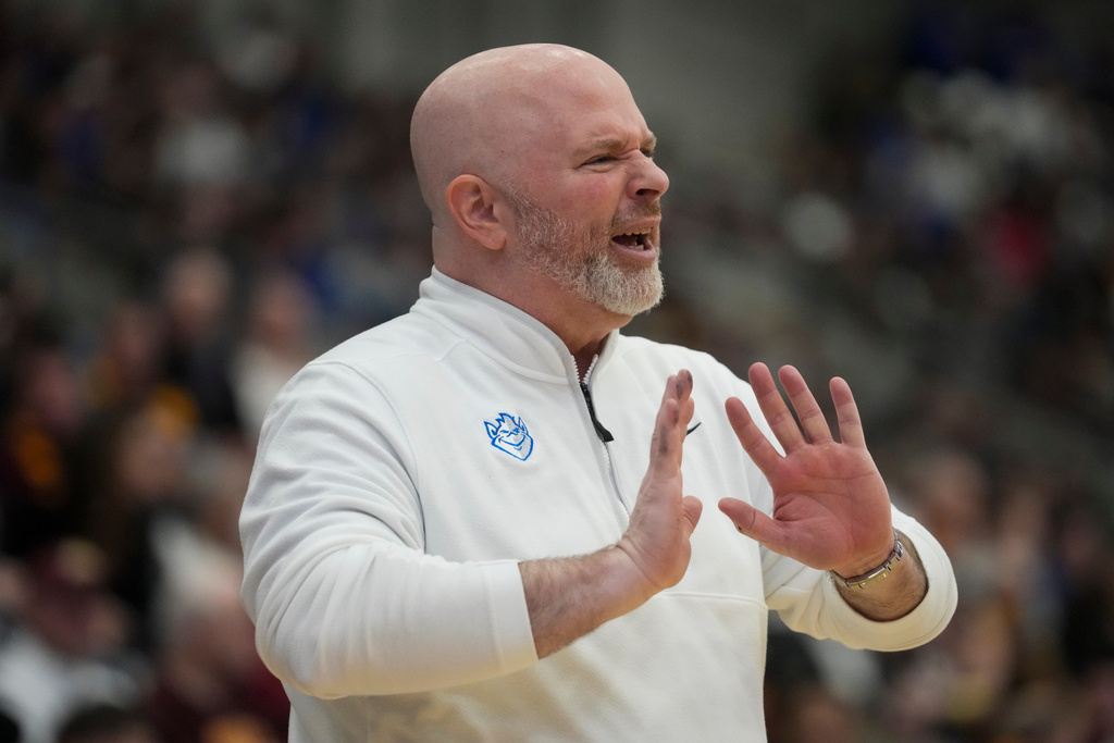 Saint Louis head coach Josh Schertz talks to his players during the second half of an NCAA college basketball game against Loyola Chicago, Friday, Feb. 13, 2026, in Chicago. (AP Photo/Erin Hooley)