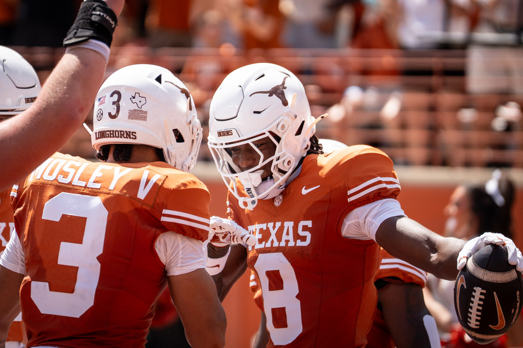 Texas wide receiver Cam Coleman (8) celebrates scoring a touchdown the Texas State during an NCAA college football game, Saturday, Sept. 5, 2026, in Austin, Texas. (Sara Diggins/The San Antonio Express-News via AP)