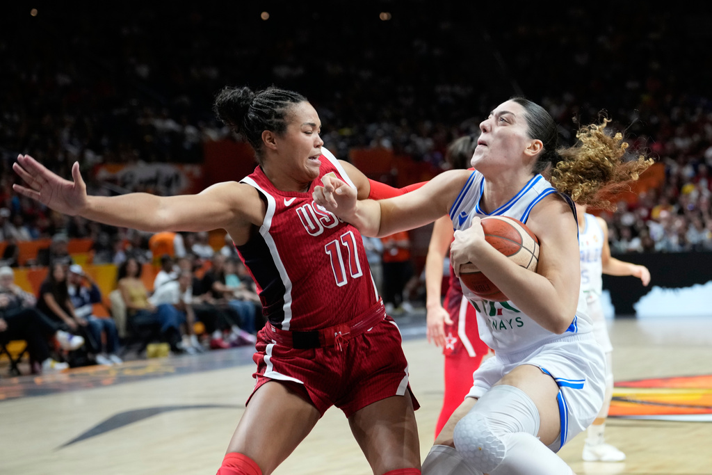 Napheesa Collier, of the United States, guards Italy's Lorela Cubaj during the Women's Basketball World Cup match between the United States and Italy in Berlin, Sunday, Sept. 6, 2026. (AP Photo/Ebrahim Noroozi)