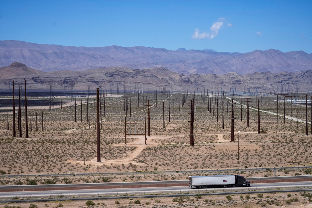 A truck is driven past electrical infrastructure, Thursday, April 2, 2026, in North Las Vegas. (AP Photo/Ty ONeil)