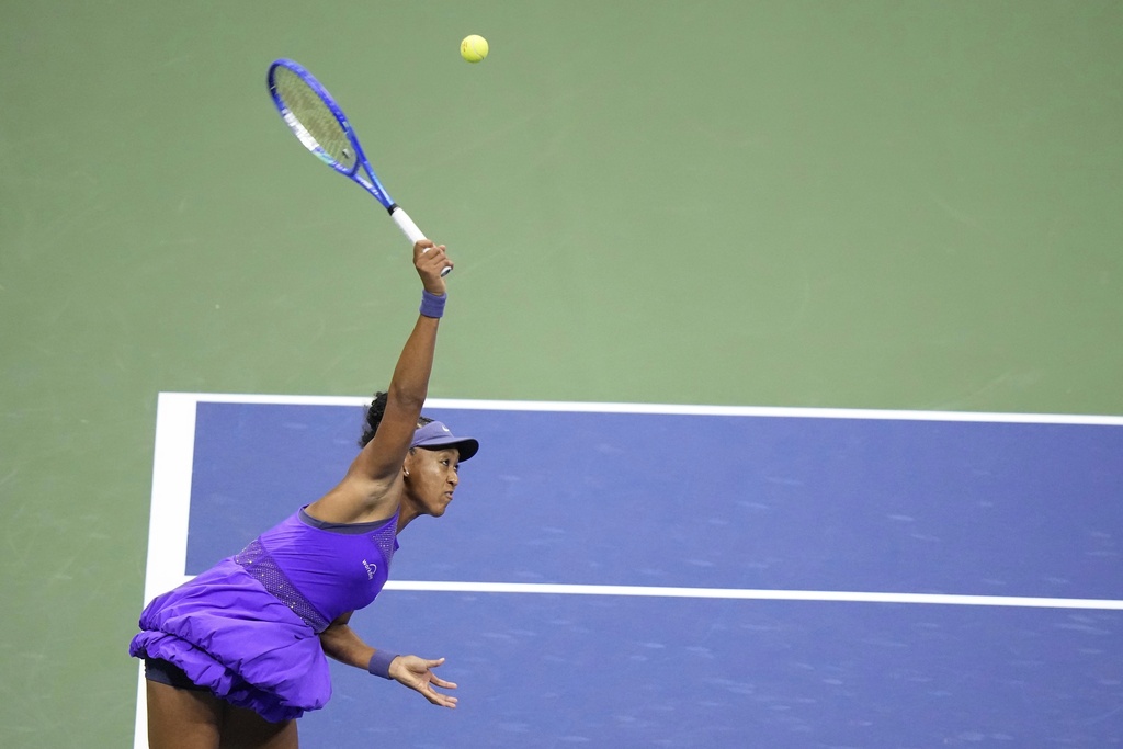 Naomi Osaka, of Japan, serves to Amanda Anisimova, of the United States, during the women's singles semifinals of the U.S. Open tennis championships, Thursday, Sept. 4, 2025, in New York. (AP Photo/Frank Franklin II)