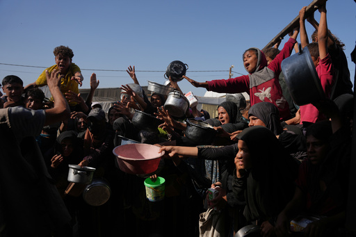 Palestinians wait to get donated sugar and rice at a community kitchen in Khan Younis, southern Gaza Strip, Friday, Oct. 31, 2025. (AP Photo/Abdel Kareem Hana) Palestinians wait to get donated sugar and rice at a community kitchen in Khan Younis, southern Gaza Strip, Friday, Oct. 31, 2025. (AP Photo/Abdel Kareem Hana)