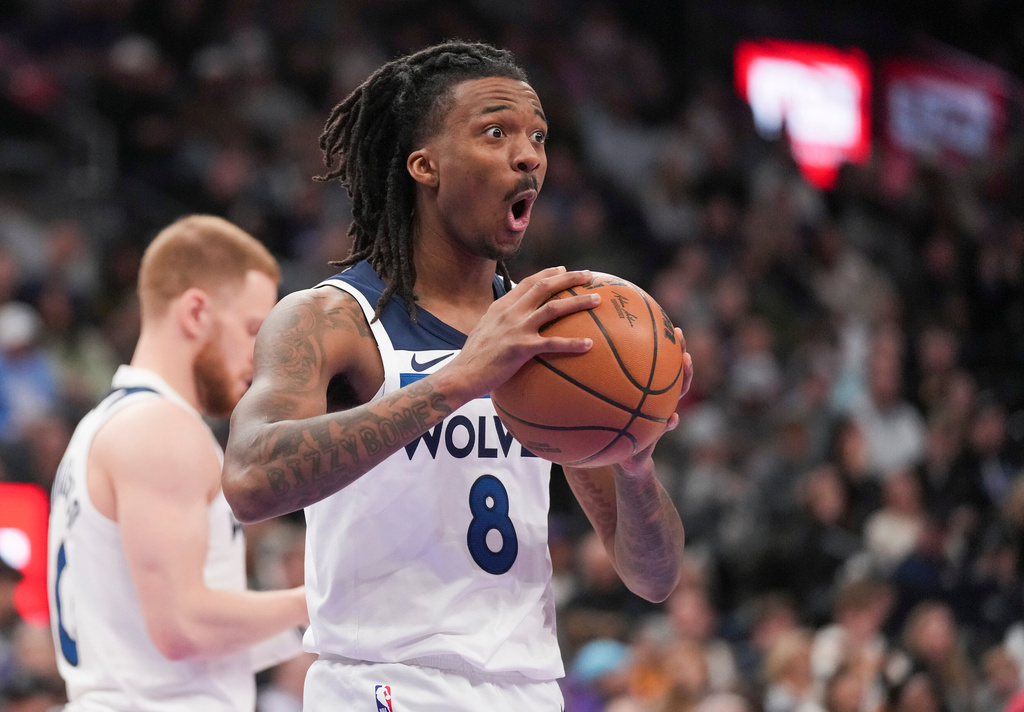 Minnesota Timberwolves guard Bones Hyland (8) reacts to a call during the first half of an NBA basketball game between the Utah Jazz and the Minnesota Timberwolves Tuesday, Jan. 20, 2026, in Salt Lake City. (AP Photo/Bethany Baker)