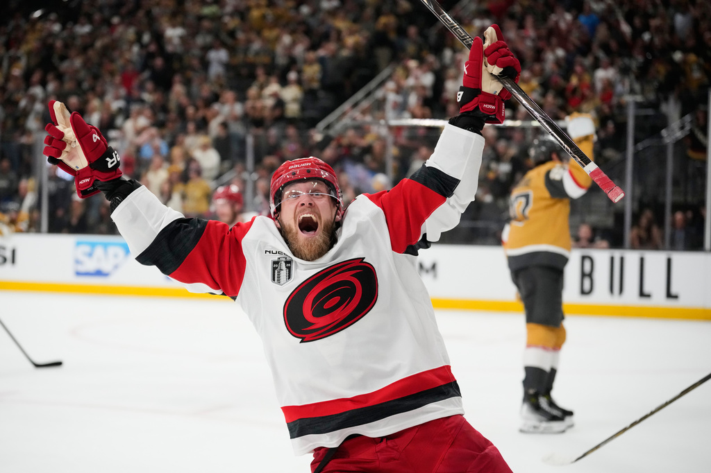 Carolina Hurricanes left wing Nikolaj Ehlers (27) celebrates after scoring an empty-net goal during the third period in Game 6 of the NHL hockey Stanley Cup Final series against the Vegas Golden Knights, Sunday, June 14, 2026, in Las Vegas. (AP Photo/John Locher)