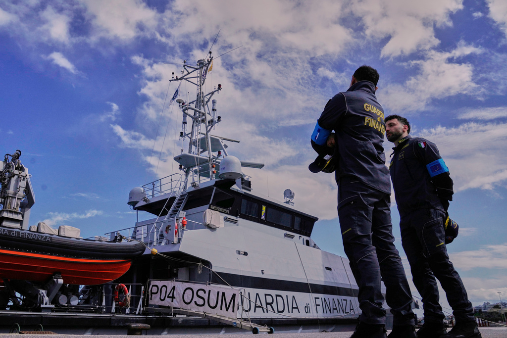 Frontex officers from the Italian Guardia Di Finanza OPV Osum prepare to go on patrol in Heraklion, at the port on Crete Island, Greece, Monday, Feb. 16, 2026. (AP Photo/Lefteris Pitarakis)