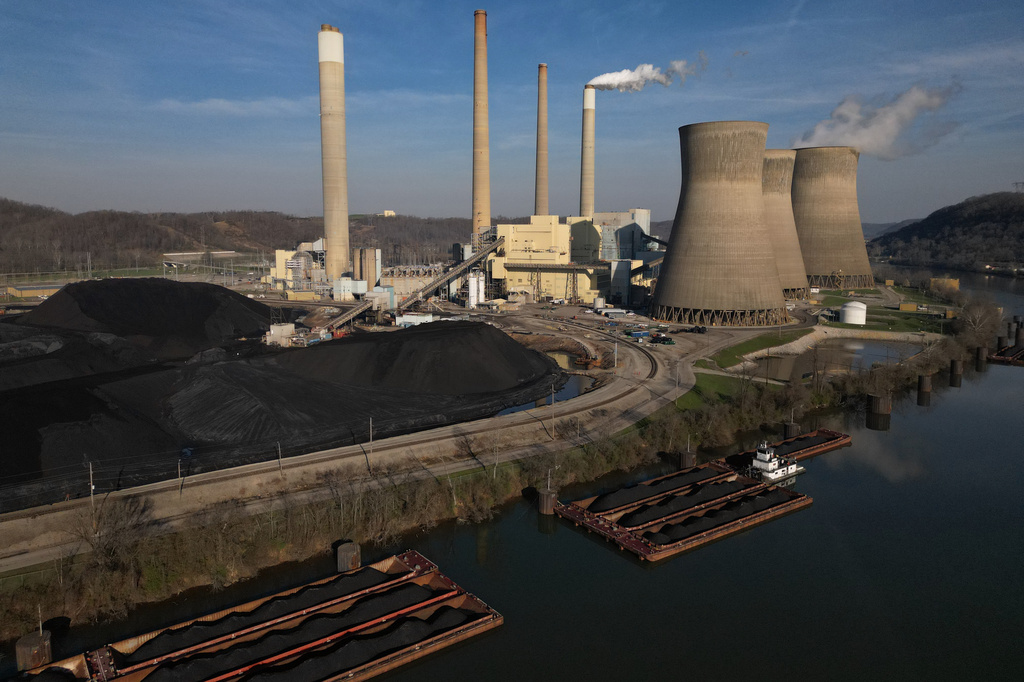 FILE - American Electric Power's John Amos coal-fired power plant in Winfield, W.Va., is seen on the banks of the Kanawha River, March 22, 2026. (AP Photo/Carolyn Kaster, File)