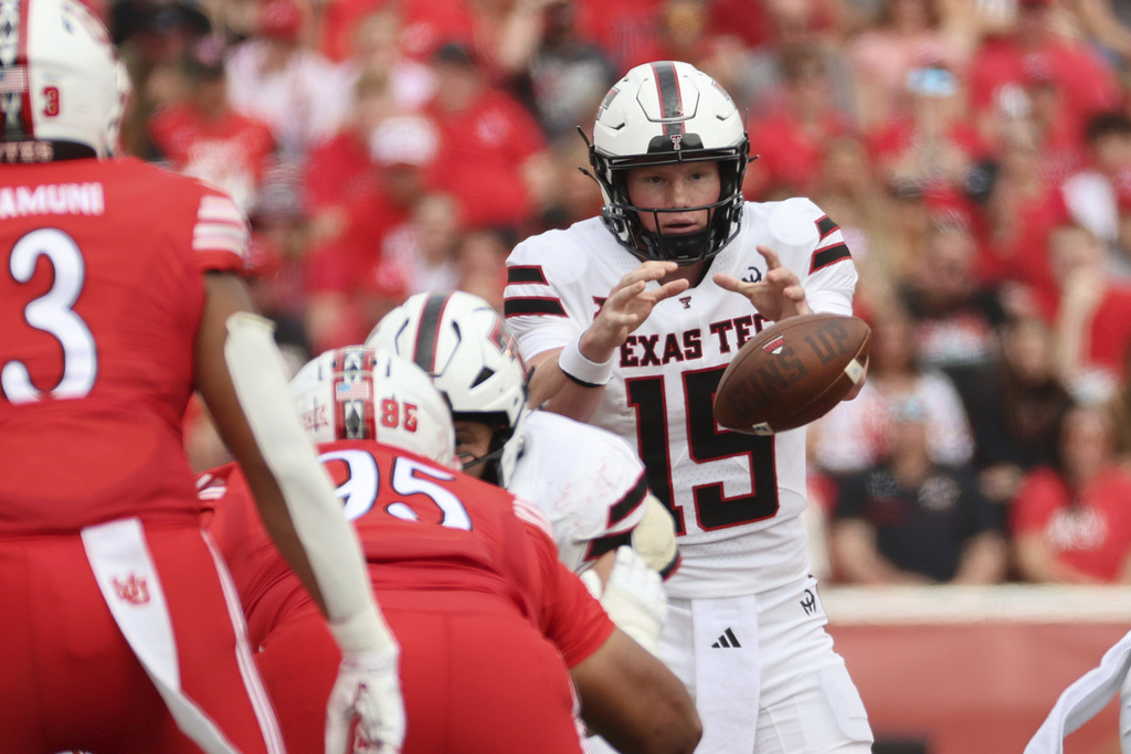 Texas Tech quarterback Will Hammond takes a snap during the second half of an NCAA college football game against Utah, Saturday, Sept. 20, 2025, in Salt Lake City, Utah. (AP Photo/Jeffrey D. Allred)