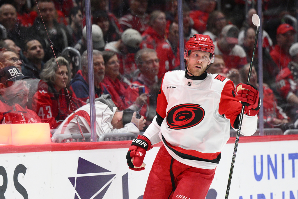 Carolina Hurricanes left wing Nikolaj Ehlers (27) celebrates his goal during the second period of an NHL hockey game against the Washington Capitals, Thursday, Dec. 11, 2025, in Washington. (AP Photo/Nick Wass)