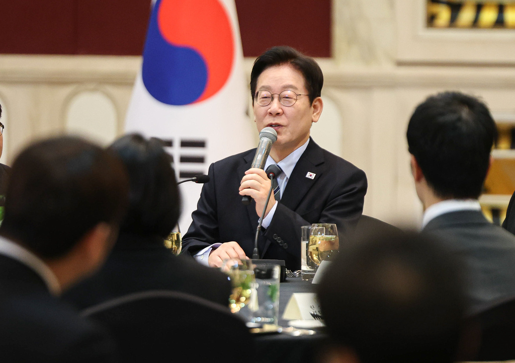 South Korean President Lee Jae Myung speaks during a meeting with members of South Korean media in Shanghai, China, Wednesday, Jan. 7, 2026. (Han Sang-kyun/Yonhap via AP)
