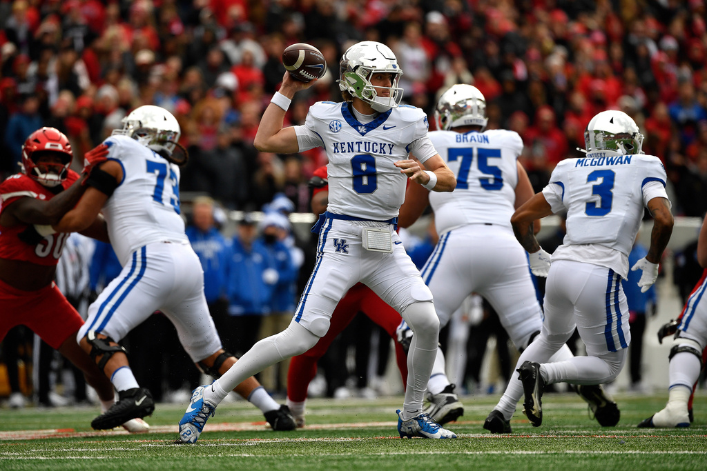 Kentucky quarterback Cutter Boley (8) attempts a pass during the first half of an NCAA college football game against Louisville in Louisville, Ky., Saturday, Nov. 29, 2025. (AP Photo/Timothy D. Easley)