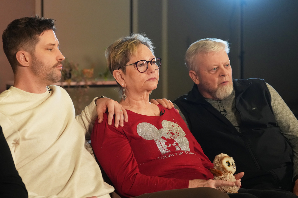 From left, Brent Ganger, brother of Renee Good, joins his parents, Donna and Tim Ganger, during an interview Friday, Feb. 27, 2026, in Denver. (AP Photo/David Zalubowski)