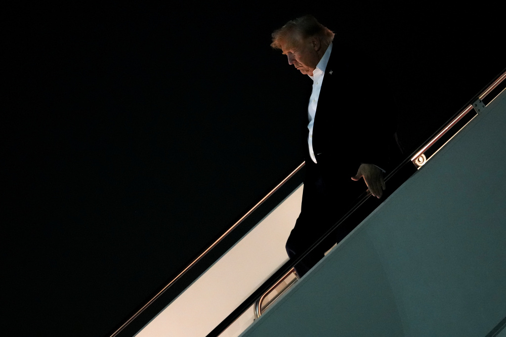 President Donald Trump disembarks Air Force One after attending the G7 summit in France, Thursday, June 18, 2026, at Joint Base Andrews, Md. (AP Photo/Julia Demaree Nikhinson)