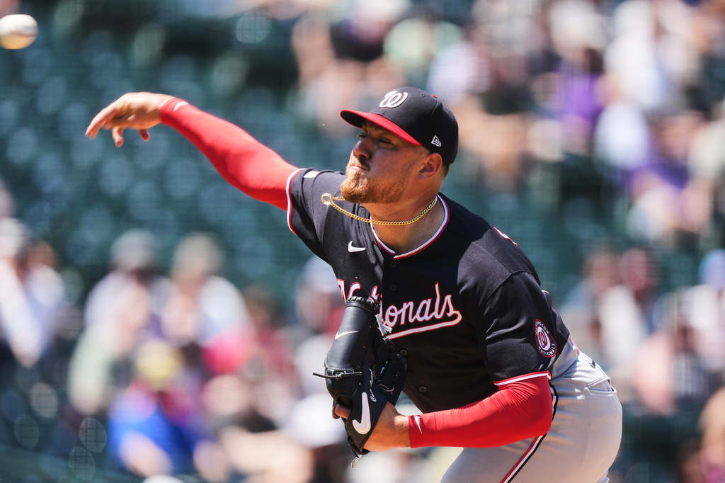 Washington Nationals starting pitcher Cade Cavalli works against the Colorado Rockies in the first inning of a baseball game Wednesday, July 22, 2026, in Denver. (AP Photo/David Zalubowski)
