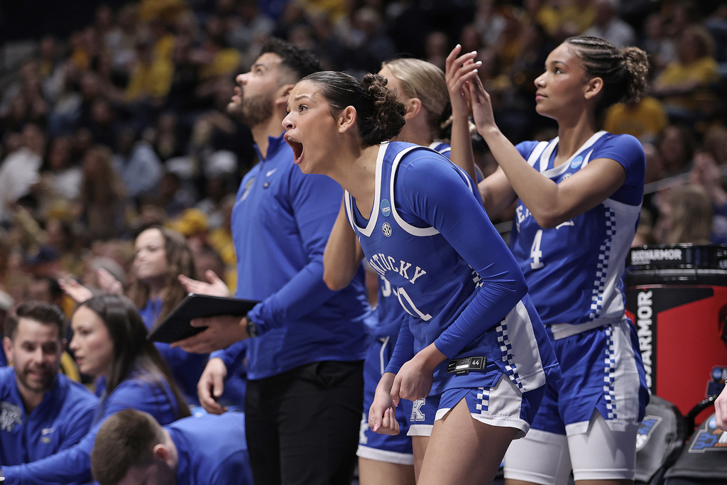 Kentucky guard Gabby Brooks (11) reacts alongside teammates in the first half in the second round of the NCAA college basketball tournament against West Virginia, Monday, March 23, 2026, in Morgantown, W.Va. (AP Photo/Kathleen Batten)
