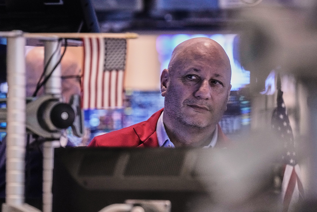 Trader John Mauro works on the floor of the New York Stock Exchange, Thursday, Jan. 8, 2026. (AP Photo/Richard Drew)