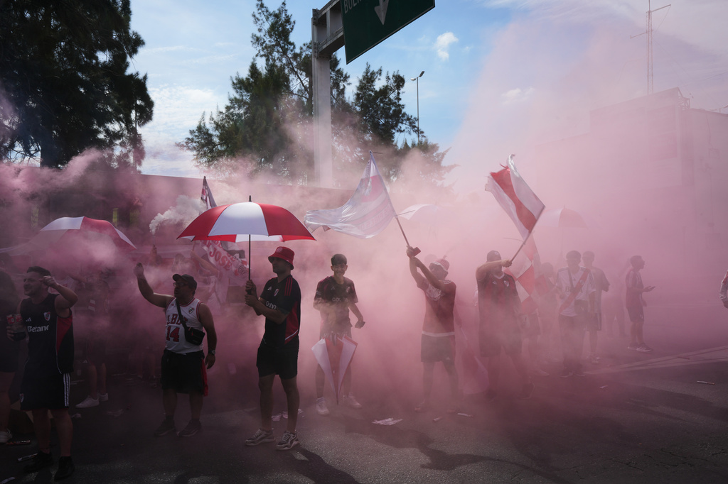 River Plate fans gather on a highway prior to an Argentine league match against Boca Juniors in Buenos Aires, Argentina, Sunday, April 19, 2026. (AP Photo/Rodrigo Abd)