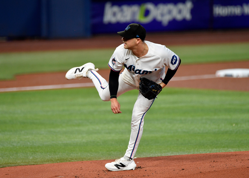 Miami Marlins pitcher Janson Junk delivers during the first inning of a baseball game against the Atlanta Braves, Wednesday, May 20, 2026, in Miami. (AP Photo/Michael Laughlin)