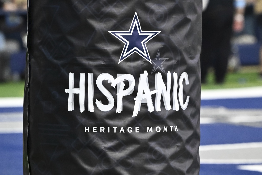 A detail view of a Hispanic Heritage Month goal post wrap during the second half of an NFL football game between the Baltimore Ravens and the Dallas Cowboys, Sunday, Sept. 22, 2024, in Arlington, Texas. The Ravens defeated the Cowboys 28-25. (AP Photo/Maria Lysaker)