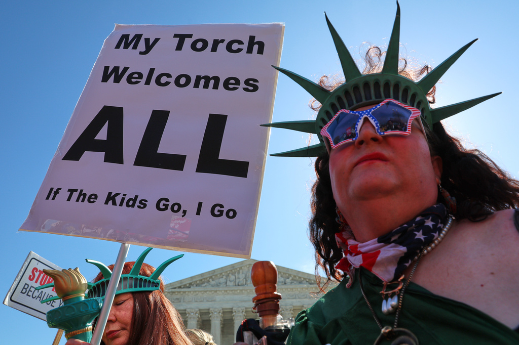 Demonstrators rally outside the U.S. Supreme Court as justices hear oral arguments on whether President Donald Trump can deny citizenship to children born to parents who are in the United States illegally or temporarily, on Capitol Hill in Washington, Wednesday, April 1, 2026. (AP Photo/Tom Brenner)