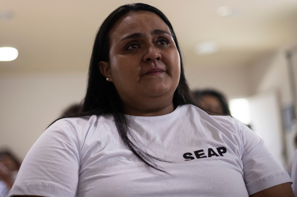 Emily de Souza cries during a program part of the Federal University of Rio de Janeiro's "Literature, Existence and Resistance" project, at the Djanira Dolores de Oliveira women's prison in Rio de Janeiro, Wednesday, March 25, 2026. (AP Photo/Bruna Prado)
