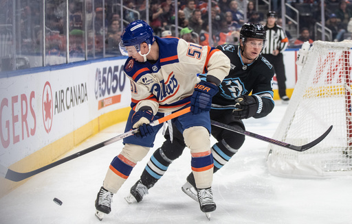 Utah Mammoth's Olli Maatta (right) and Edmonton Oilers' Troy Stecher (51) battle for the puck during first period NHL action, in Edmonton on Tuesday, October 28, 2025. (Jason Franson/The Canadian Press via AP) Utah Mammoth's Olli Maatta (right) and Edmonton Oilers' Troy Stecher (51) battle for the puck during first period NHL action, in Edmonton on Tuesday, October 28, 2025. (Jason Franson/The Canadian Press via AP)