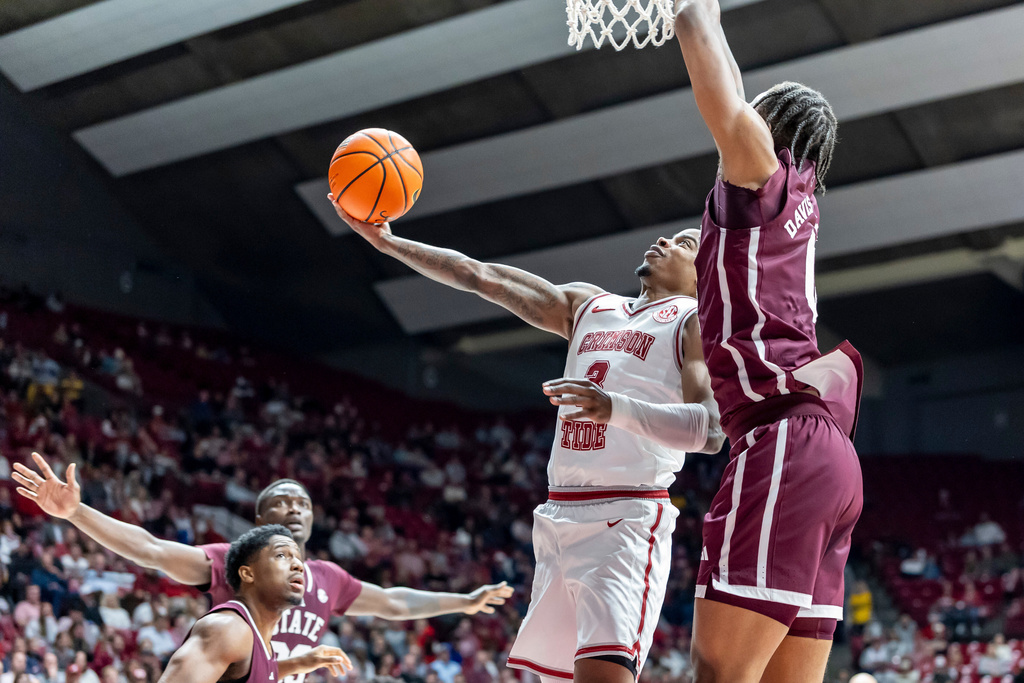 Alabama guard Latrell Wrightsell Jr. works past Mississippi State forward Jamarion Davis-Fleming for a shot during the first half of an NCAA college basketball game, Wednesday, Feb. 25, 2026, in Tuscaloosa, Ala. (AP Photo/Vasha Hunt)