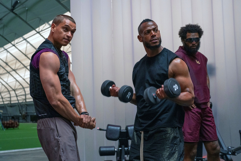 This image released by Universal Pictures shows Tyriq Withers, left, and Marlon Wayans in a scene from "Him." (Parrish Lewis/Universal Pictures via AP)