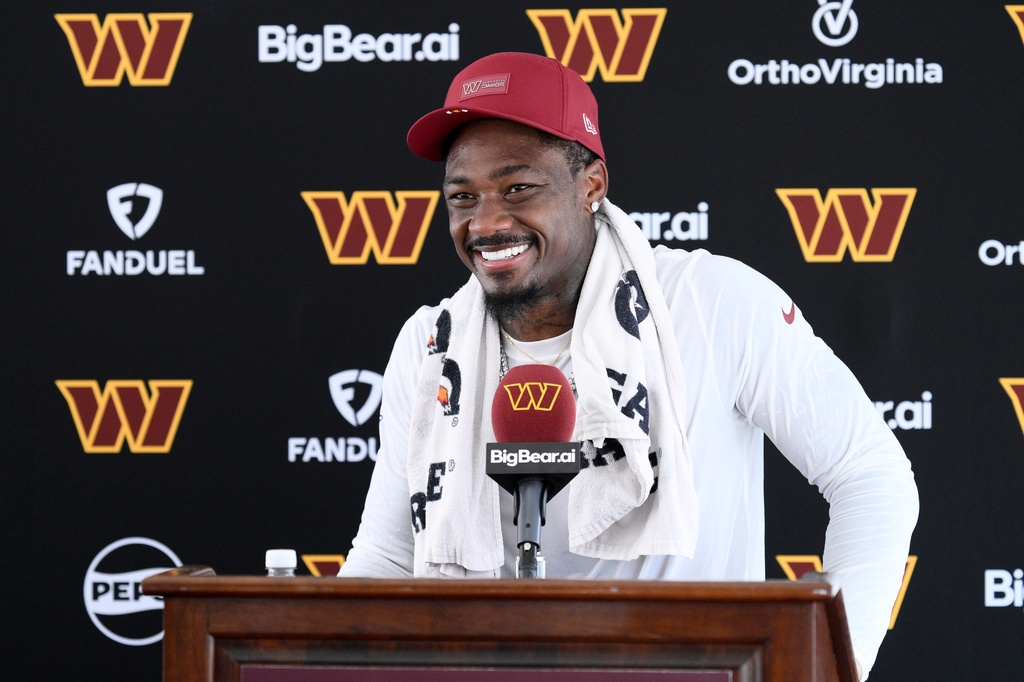 Washington Commanders wide receiver Stefon Diggs speaks to the media after practice at the team's NFL football training camp, Friday, Aug. 7, 2026 in Ashburn, Va. (AP Photo/Nick Wass)