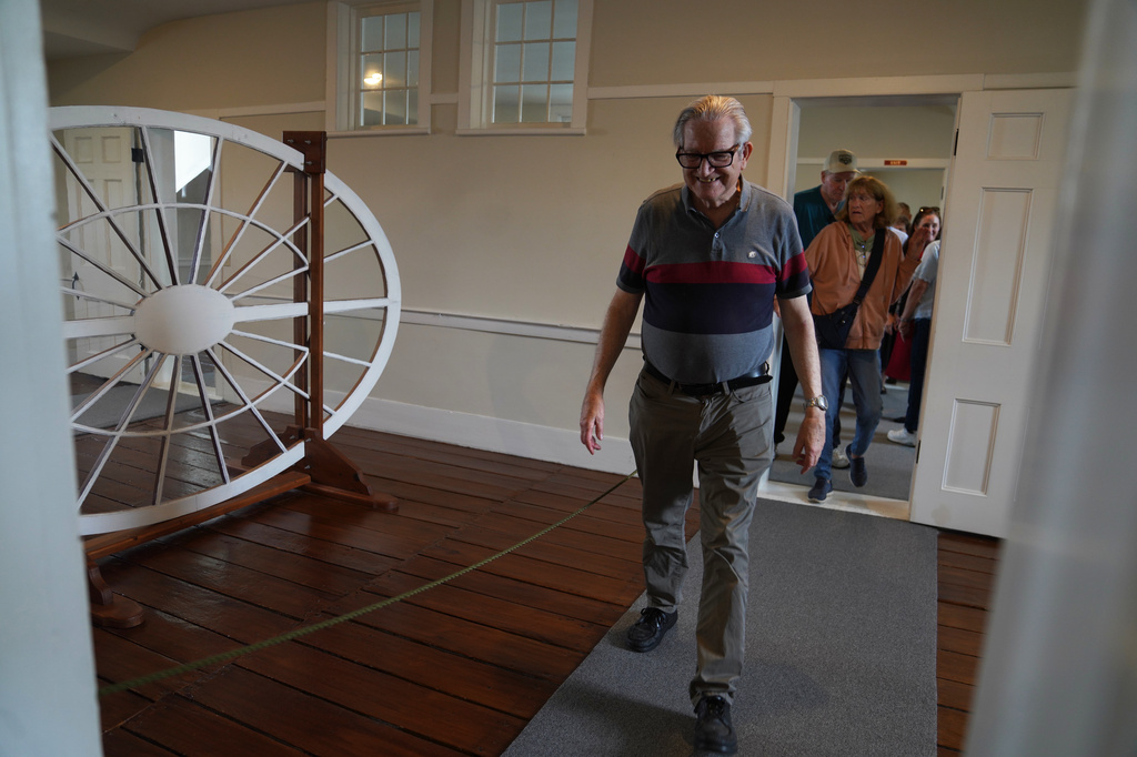 Visitors from around the country tour the third floor of the Kirtland temple, a nearly two-century old sanctuary considered the first temple in the movement Joseph Smith founded, on Wednesday, June 15, 2026, in Kirtland, Ohio. (AP Photo/Jessie Wardarski)