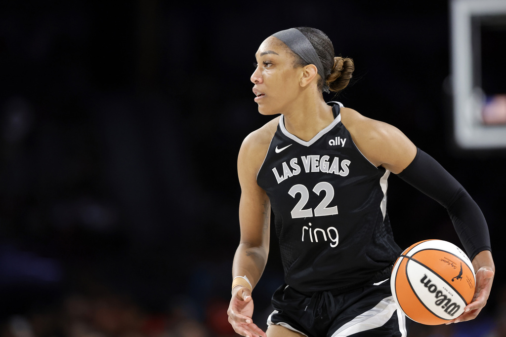 Las Vegas Aces center A'ja Wilson controls the ball during the second half of a WNBA basketball game against the Connecticut Sun, Sunday, Aug. 10, 2025, in Las Vegas. (Steve Marcus/Las Vegas Sun via AP)
