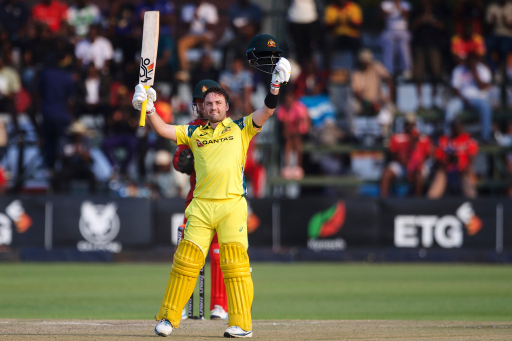 Australia's Josh Inglis celebrates reaching 100 runs during the third one day international cricket match between Zimbabwe and Australia in Harare, Zimbabwe, Sunday, Sept. 20, 2026. (AP Photo/Wonder Mashura)