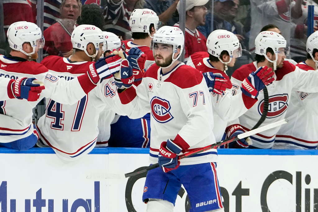 Montréal Canadiens center Kirby Dach (77) celebrates with the bench after his goal against the Tampa Bay Lightning during the second period in Game 5 of an NHL hockey Stanley Cup first-round playoff series, Wednesday, April 29, 2026, in Tampa, Fla. (AP Photo/Chris O'Meara)