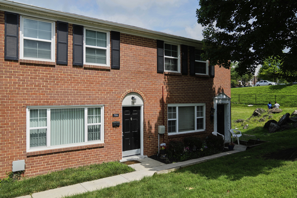 The townhome where Maria Pires lived as a child, after being adopted from a Brazilian orphanage by Floyd Sykes III, stands in Baltimore, Monday, July 14, 2025. (AP Photo/Stephanie Scarbrough)