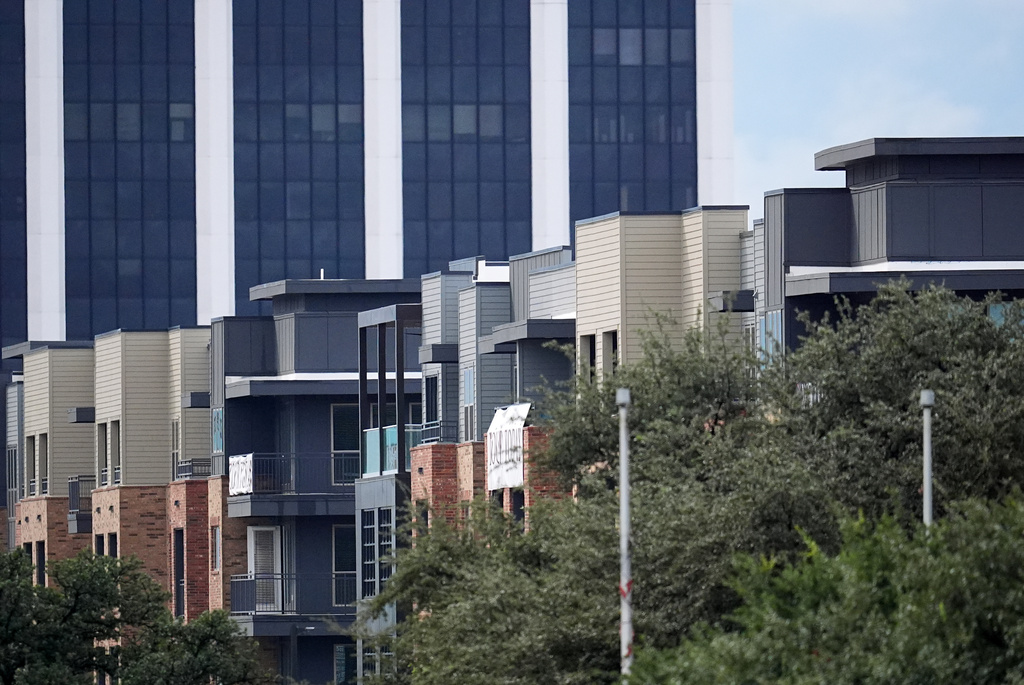 An apartment building close to a U.S. Immigration and Customs Enforcement office is shown after a shooting, in Dallas on Wednesday, Sept. 24, 2025. (AP Photo/Julio Cortez)
